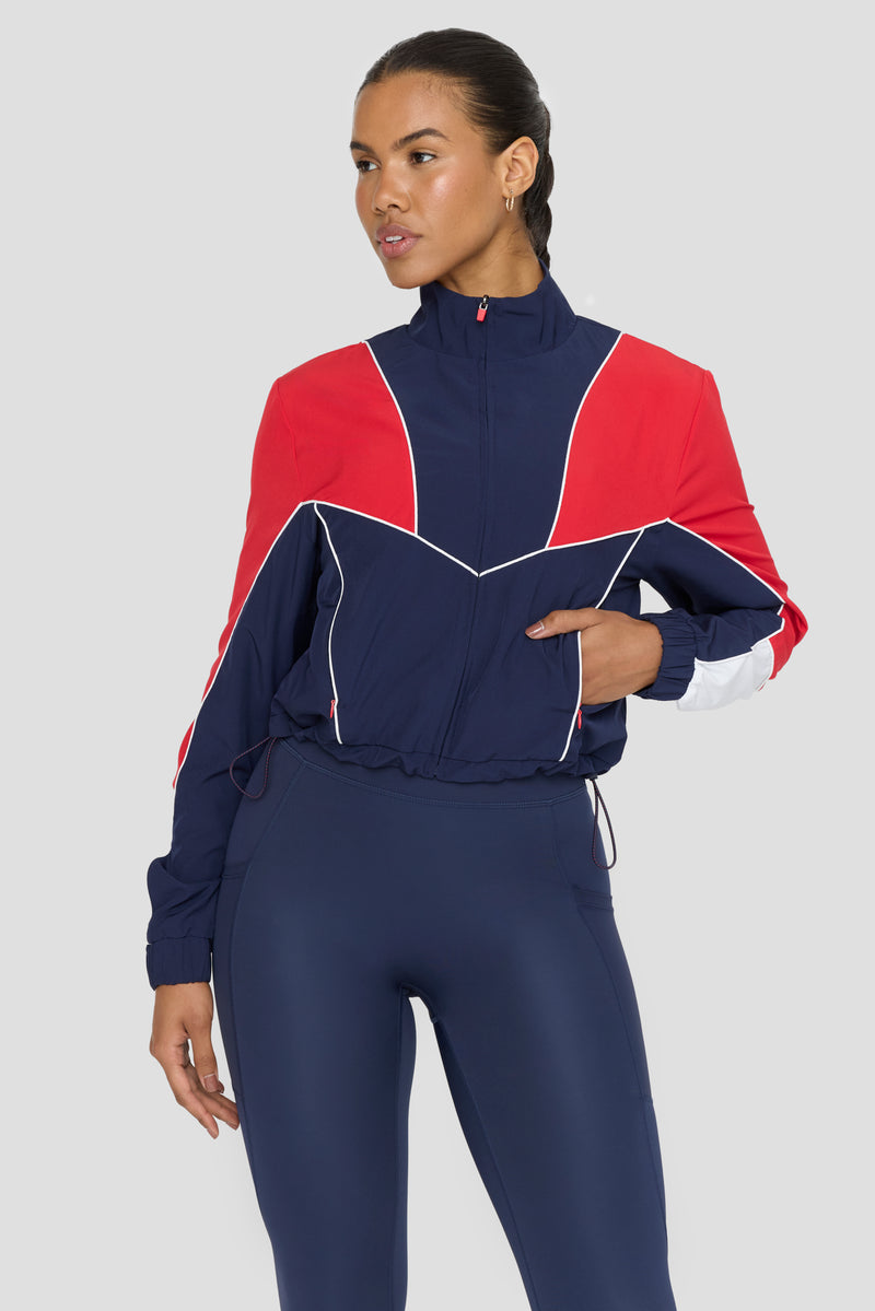 REVERSIBLE WOVEN TRACK JACKET - NAVY AND CHILLI RED