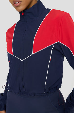 REVERSIBLE WOVEN TRACK JACKET - NAVY AND CHILLI RED