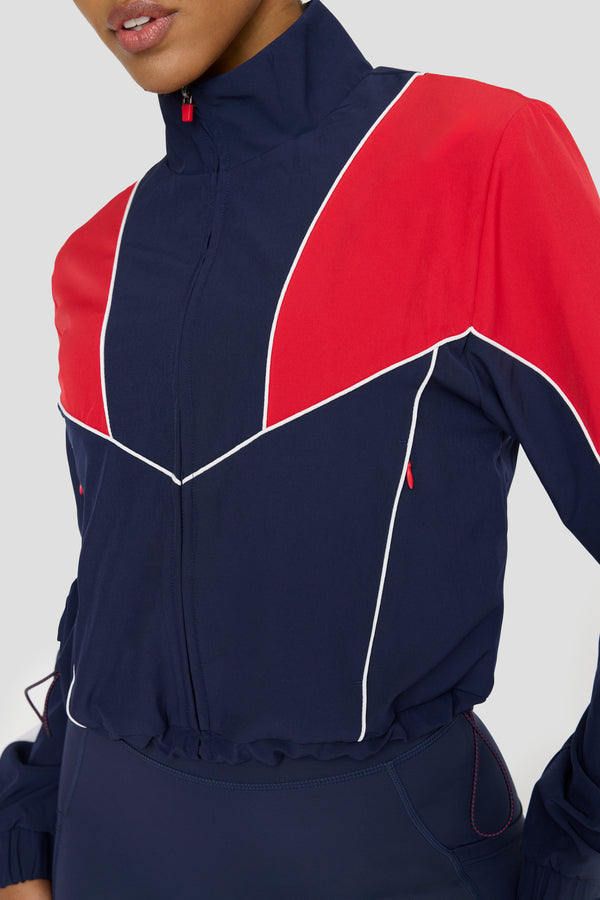 REVERSIBLE WOVEN TRACK JACKET - NAVY AND CHILLI RED