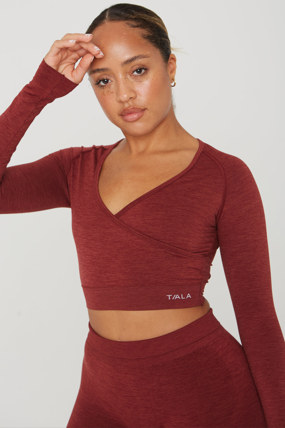 SCULPT SEAMLESS WRAP LONG SLEEVE CROP TOP - OXBLOOD RED MARL